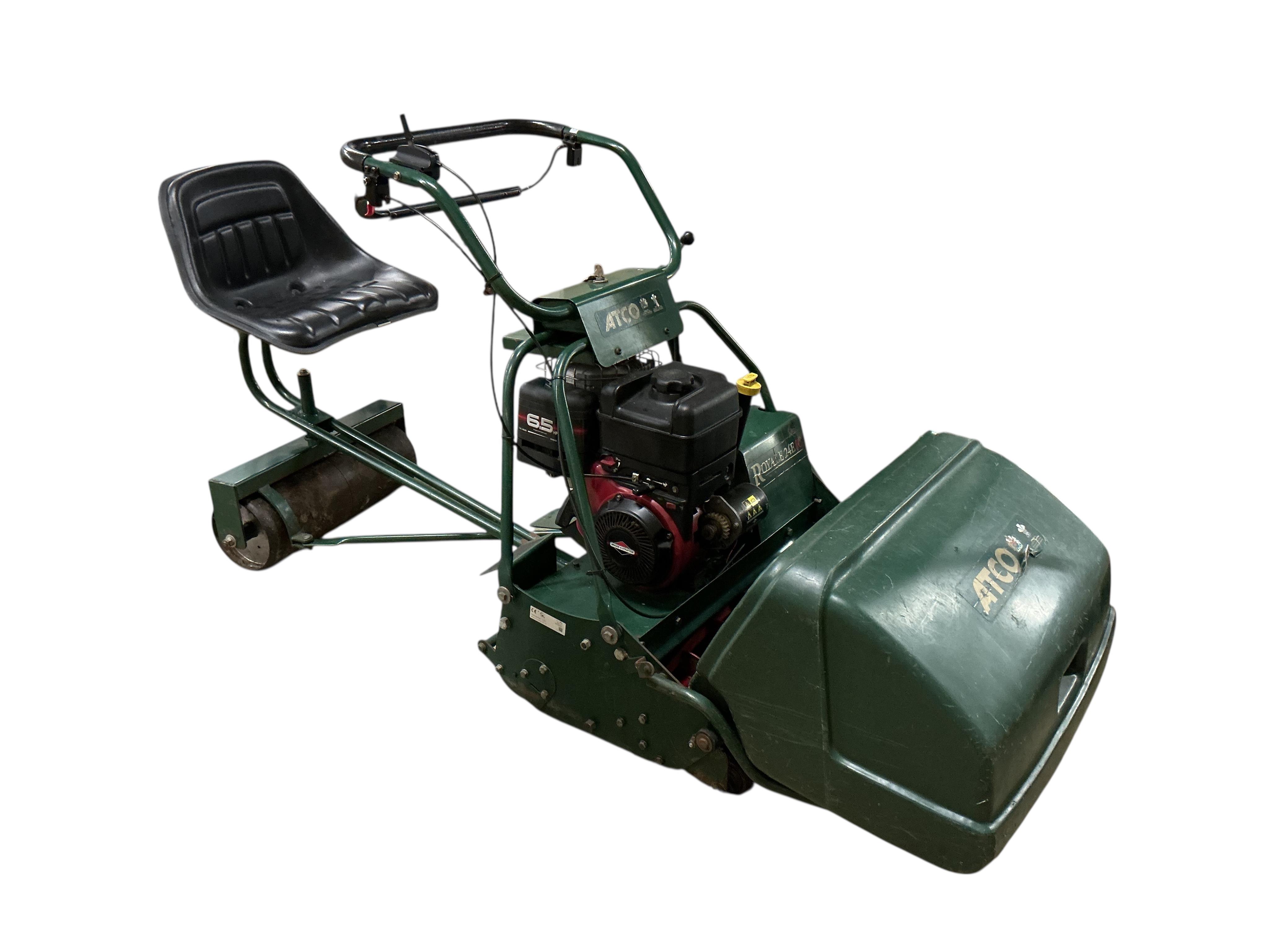 An Atco Royale 24E 6.5 HP 24inch ride on cylinder petrol mower. Serviced annually and in good working order with operating manuals